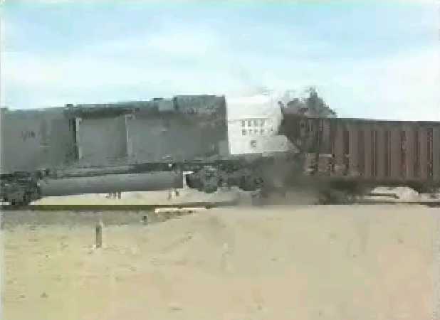 Locomotive impacting hopper cars.